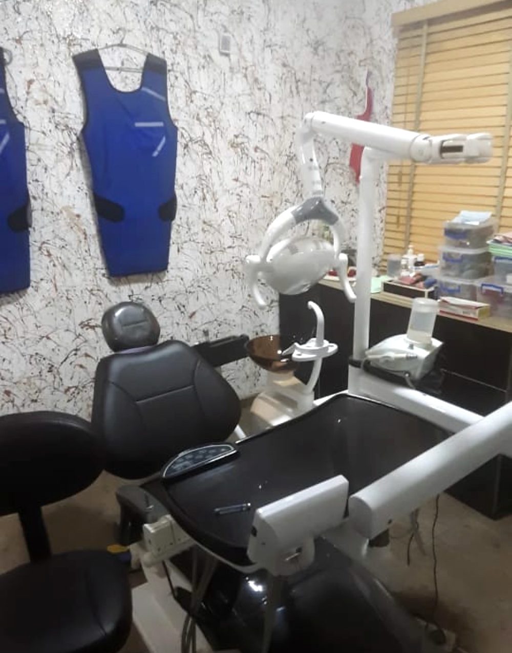 Protective aprons and dental unit at JIK Dental Clinic