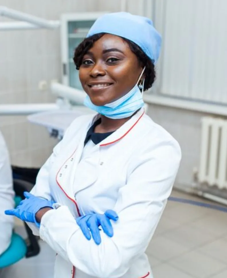 Smiling dentist in a dental treatment room
